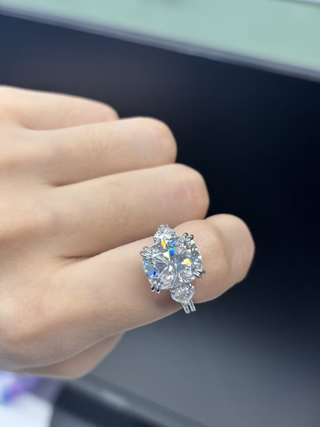 Customer photo review of Moissanite 6.0Ct Cushion Cut Three Stone Engagement Ring In Sterling Silver