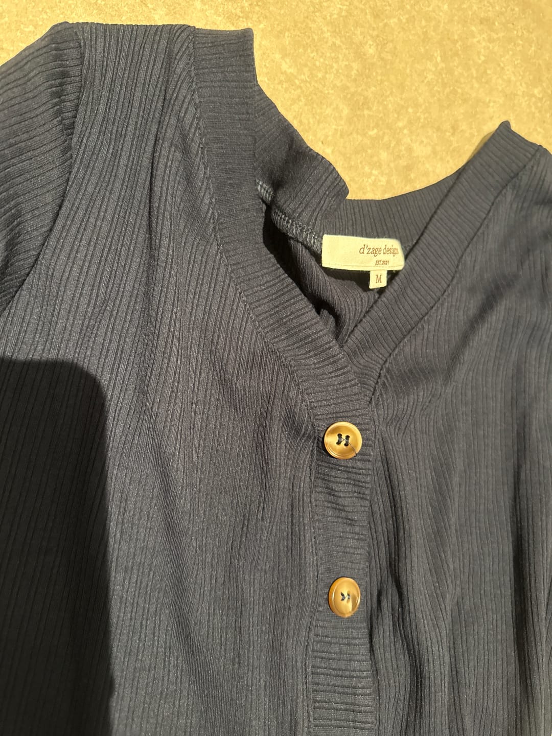 Customer photo review of Buttoned V-neck Knit Top