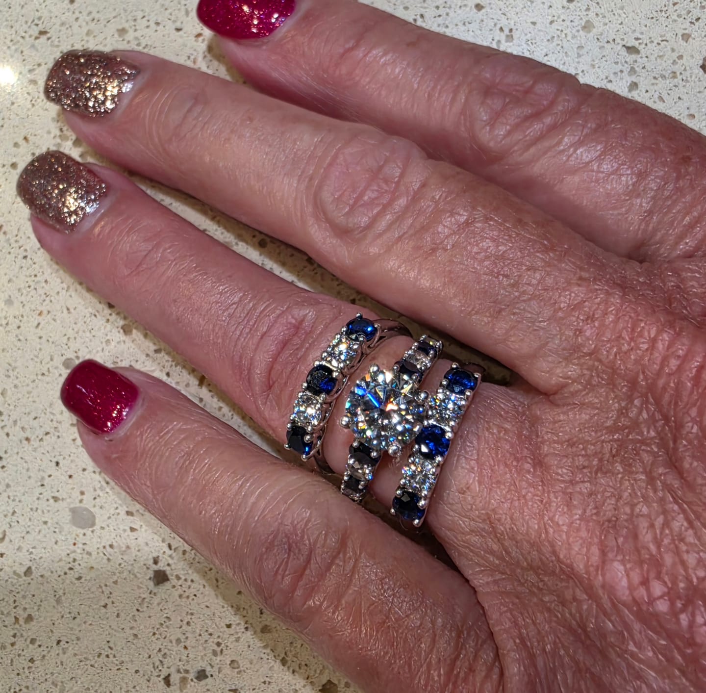 Customer photo review of Five Stone Moissanite and Sapphire Wedding Band Ring In Sterling Silver