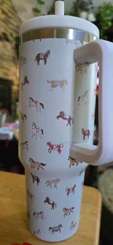 Customer's white HORSES 2 CREWCUP tumbler with a colorful horse pattern, handle, and lid.