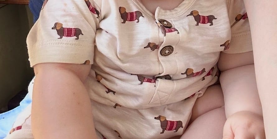 Customer photo review of Cream Sausage Dogs Organic Romper
