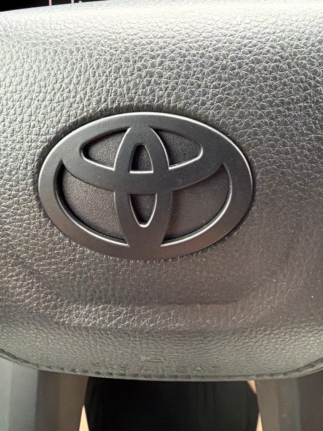 Customer photo review of NEW Black Matte Steering Wheel Emblem Fits NEW Models 2024-2026 Tacoma, 4Runner & Camry