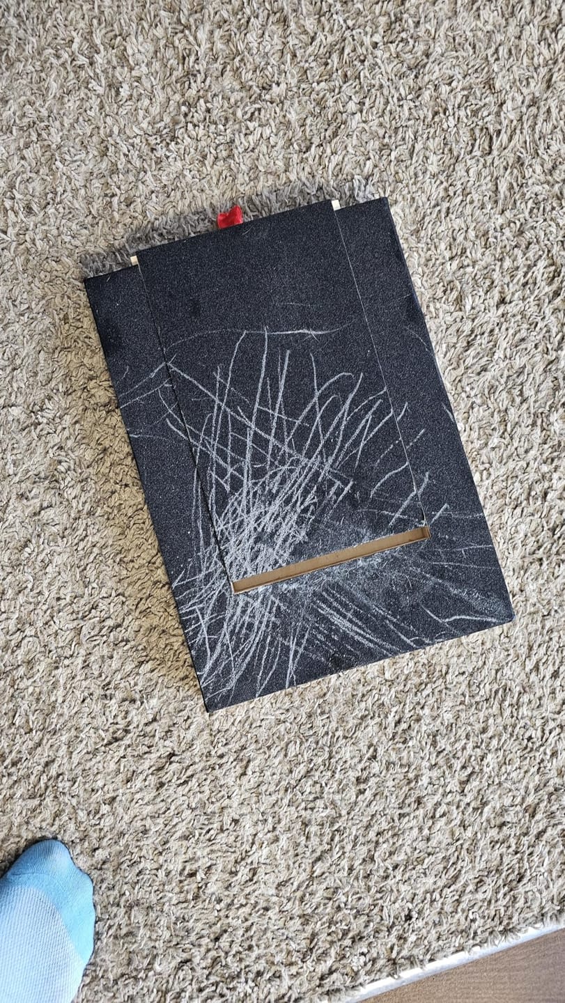 Customer photo review of Dog Nail Scratch Board with Treat Box – Stress Free Nail Filing for Dogs