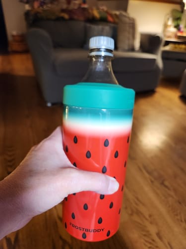 Customer holding the Universal Buddy in a Watermelon Kiss design with a soda bottle secured inside.