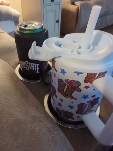 Customer's All American Sweetheart Thicc Buddy mug with a straw and handle, sitting in a loveseat cupholder.