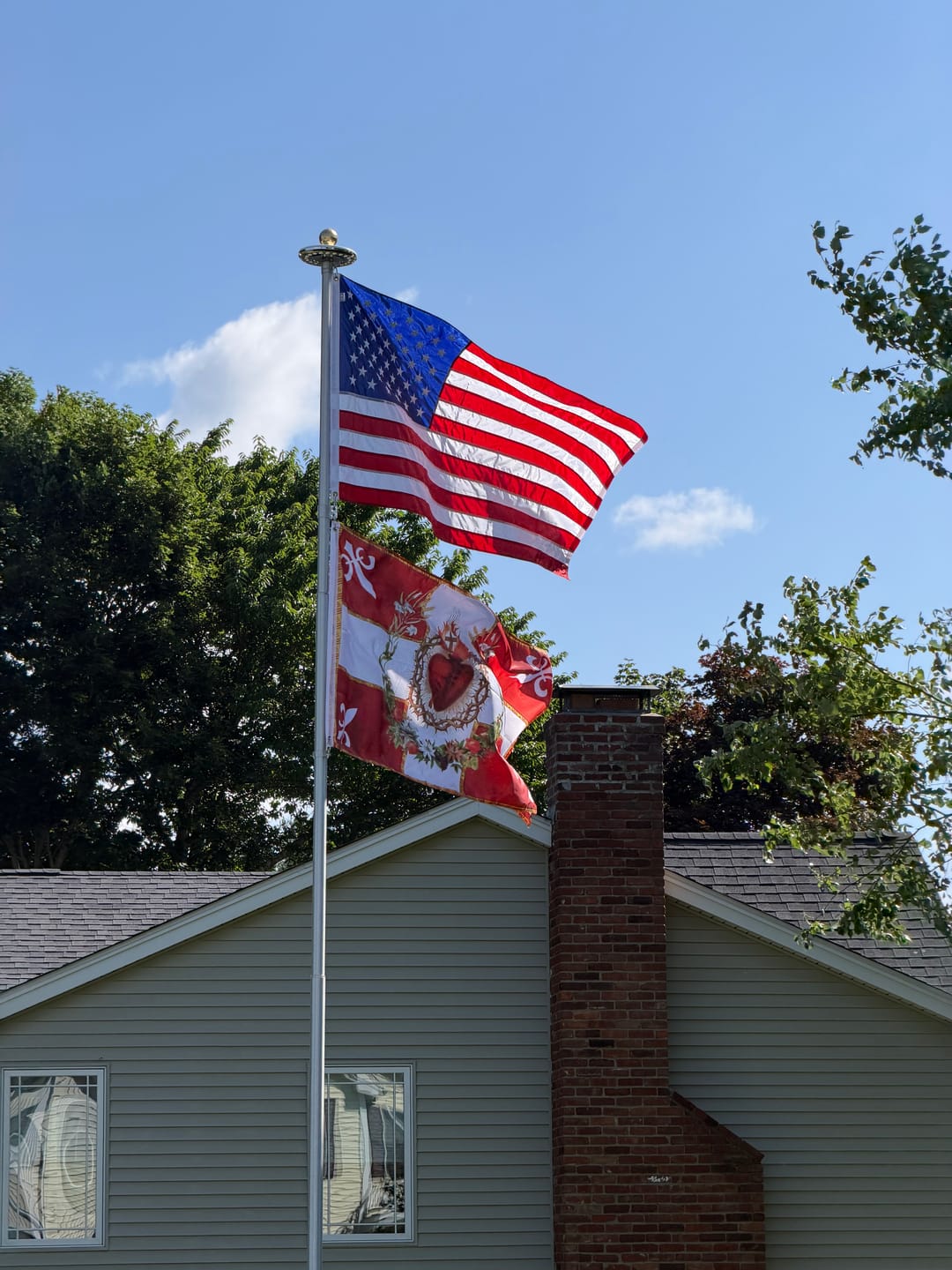 Customer photo review of Flag of the Sacred Heart – Red – Indoor/outdoor Flag – Polyester – 2x3, 3x5 and 4x6.