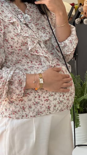 Reviewer shows their Mother's Day Gift, a gold-colored watch and delicate bracelets, on their wrist.