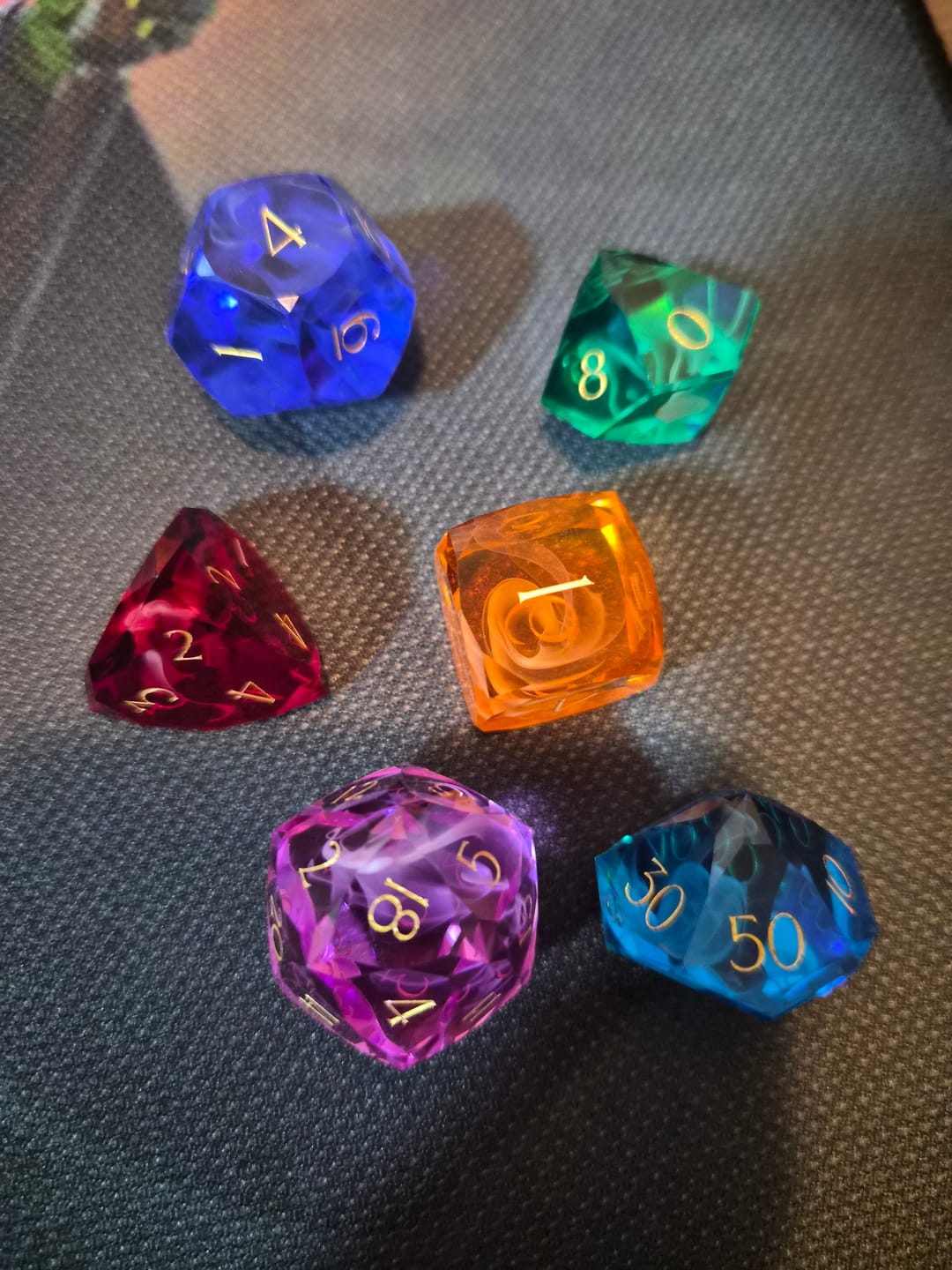 Customer photo review of URWizards D&D Resin Rainbow Engraved Dice Set Multi-faceted Style