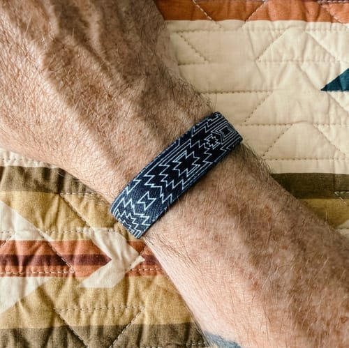 Customer wearing the God Is For Us Bible Verse Bracelet, showing the decorative outer pattern on their wrist.