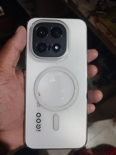 Customer's Anti Yellow Magsafe Clear Case on a white iQOO 15, showing the back and MagSafe ring.