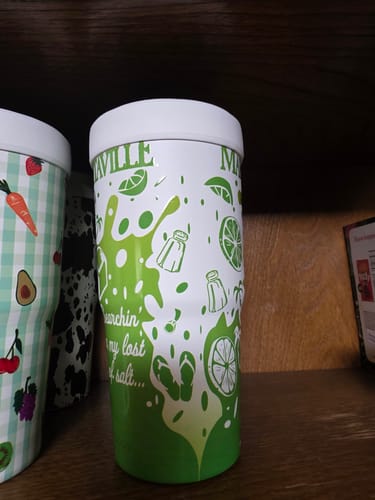 Customer's Margaritaville To-Go Buddy in the Island Lime design, sitting on a wooden shelf.