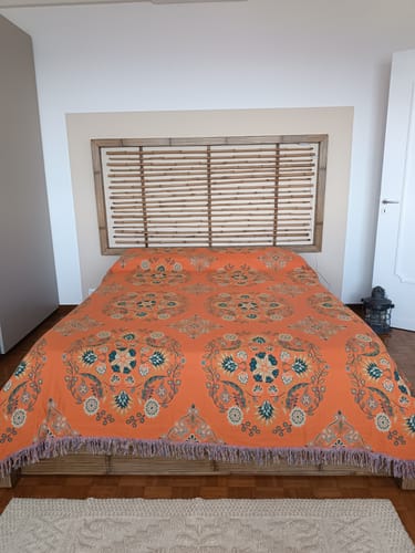 Reviewer's orange Cotton Bedcover with a detailed bohemian pattern spread neatly on a bed.