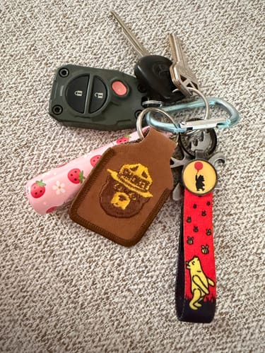 Customer's How Lucky I Am Bracelet, featuring a Winnie the Pooh design, attached to a set of car keys.