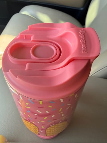 Customer's pink Thicc Buddy 40oz tumbler with the Classic Lid completely closed, shown inside a car.