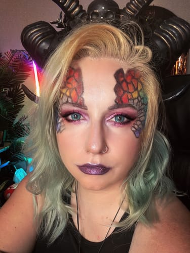 Customer with detailed rainbow scale eye makeup using the Creative Comeback XXXL Eyeshadow Palette.
