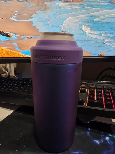 Customer's purple Nebula Universal XL can holder with a beverage can inside, sitting on a desk.