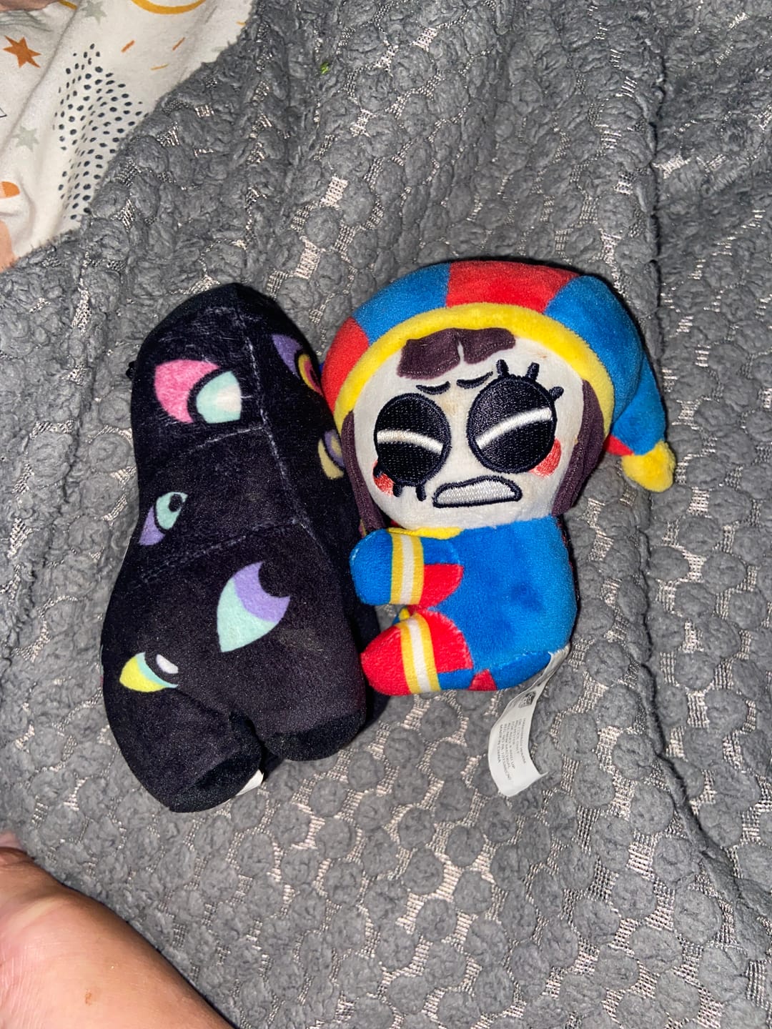 Customer photo review of Pomni & Abstraction Magnetic Plush Keychains