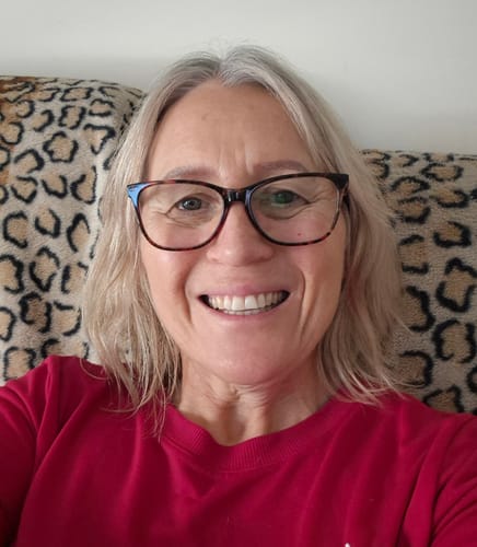 Customer smiling, showing glowing skin and reduced fine lines after two months of using Deep Collagen Cream.