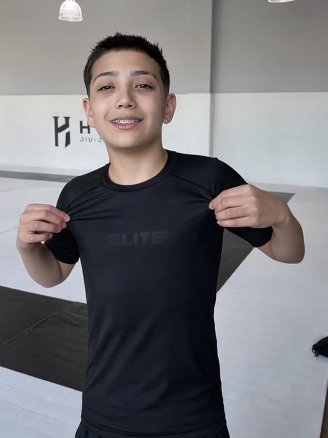 Customer photo review of Standard Black Short Sleeve No-Gi Kids BJJ Rash Guard