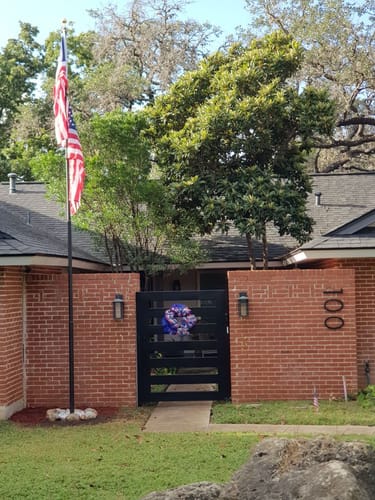 Reviewer's installed flagpole with the 1776 to 2026 Betsy Ross Flag flying at the entrance to their home.