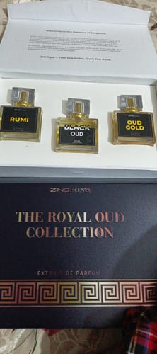 Reviewer's OUD Supreme BUNDLE with three perfume bottles displayed in their elegant 'The Royal Oud Collection' box.