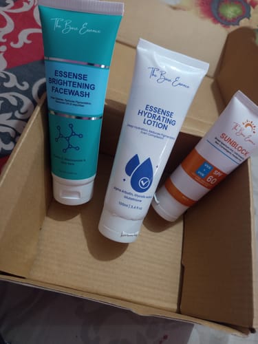 Customer's Natural Glow Pack with the facewash, hydrating lotion, and sunblock tubes displayed in a cardboard box.