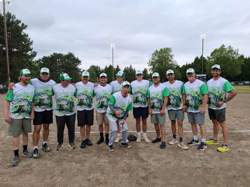 image 1 out of 2: A customer's baseball team posing on a field in their custom white and green crocodile design baseball jerseys.