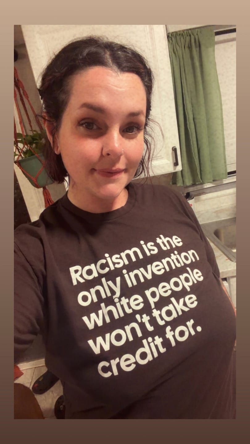 Customer photo review of Racism Is the Only Invention White People Won’t Take Credit For Unisex Tee