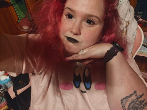 Reviewer wearing Halloween Blackout Colored Contact Lenses, showing complete coverage of their natural eye color.
