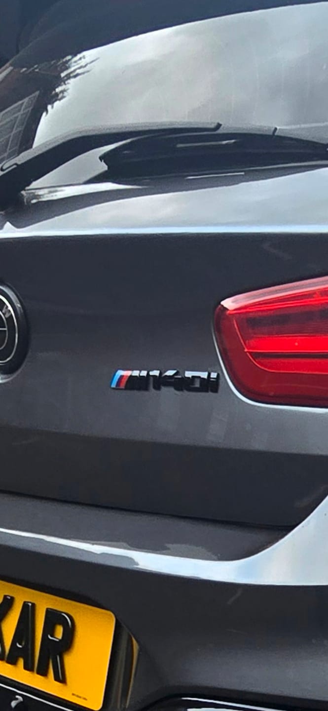 Customer photo review of Black M140i Badges