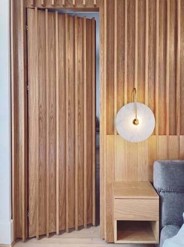 Customer photo review of ALABASTER DISC WALL LAMP — Minimalist Bedroom Sconce