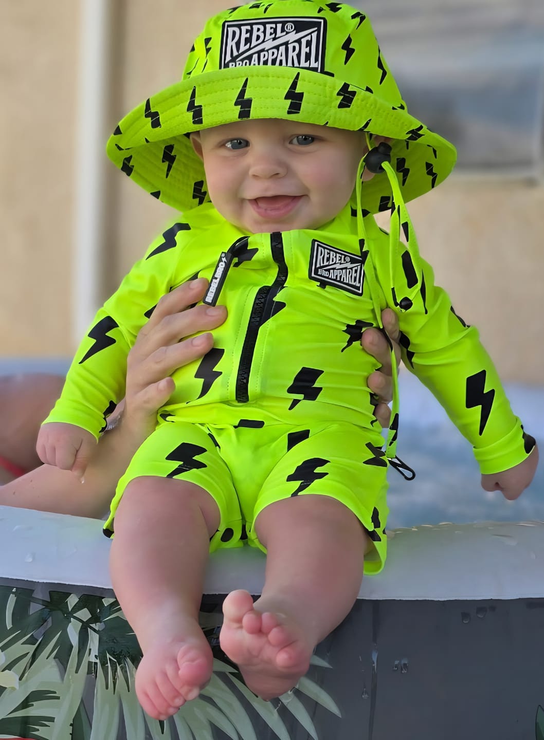 Customer photo review of UPF50+ Boys Swim Romper in Neon Electric Lime x Jagger