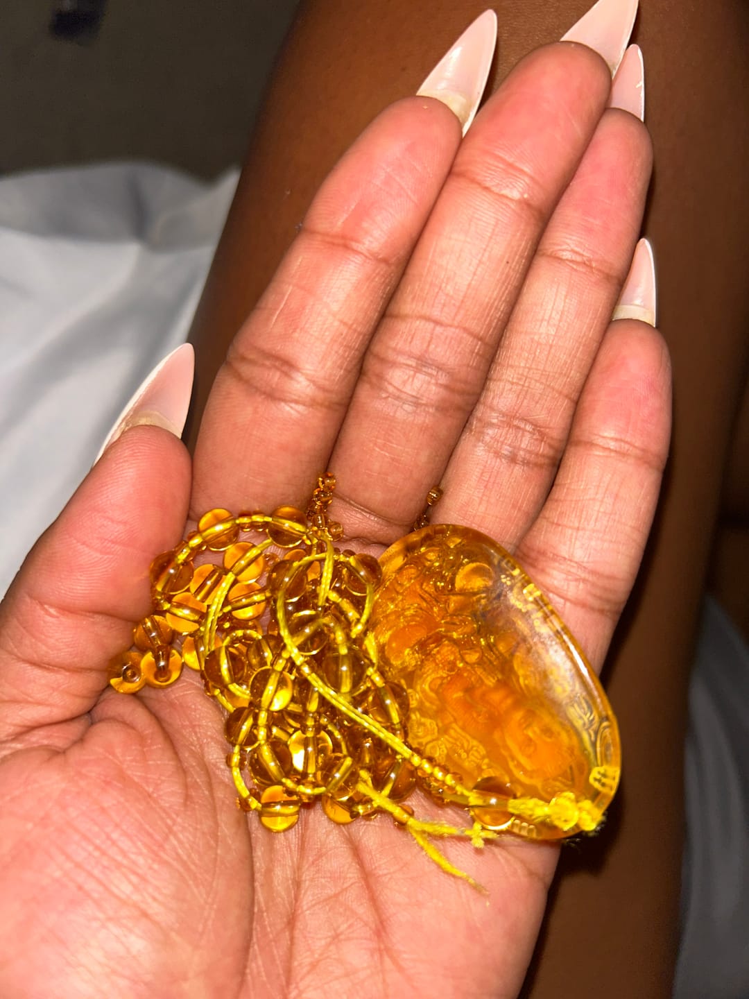 Customer photo review of Citrine Guardian Buddha Pendant Necklace