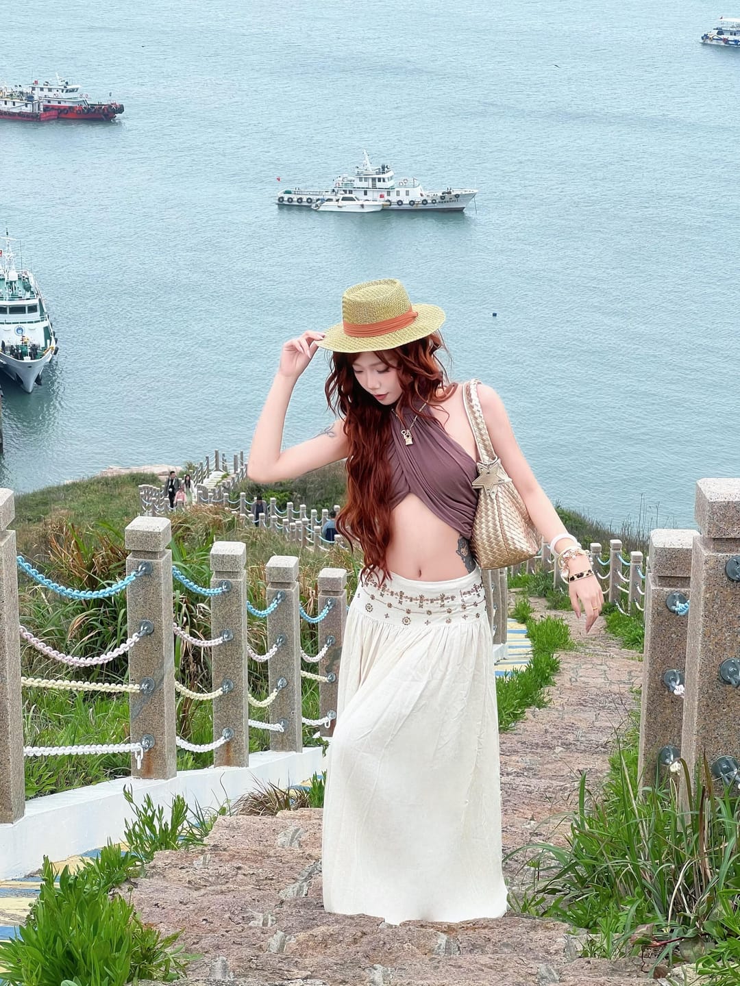 Customer photo review of ROVENTE Cross-Drape Halter Top with High Neck Twist Detail