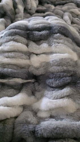 Close-up by a customer of the plush, swirled gray fabric of their Hugs Swirl Licorice Blanket.