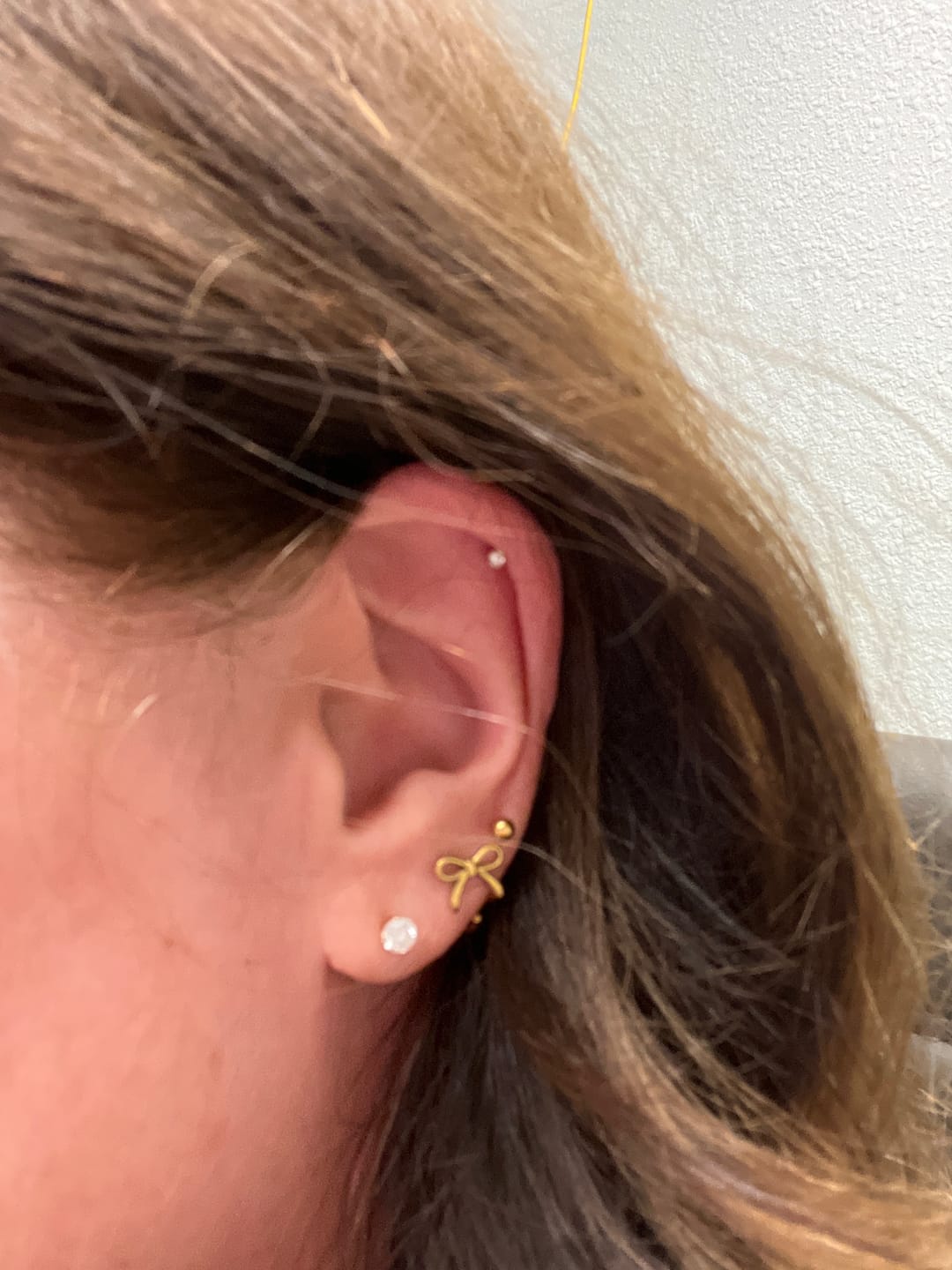 Customer photo review of Coco Bow Comfort Earrings — Gold