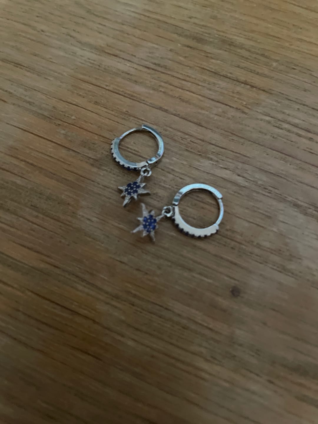 Customer photo review of Cosima Silver Blue Star Huggie Earrings
