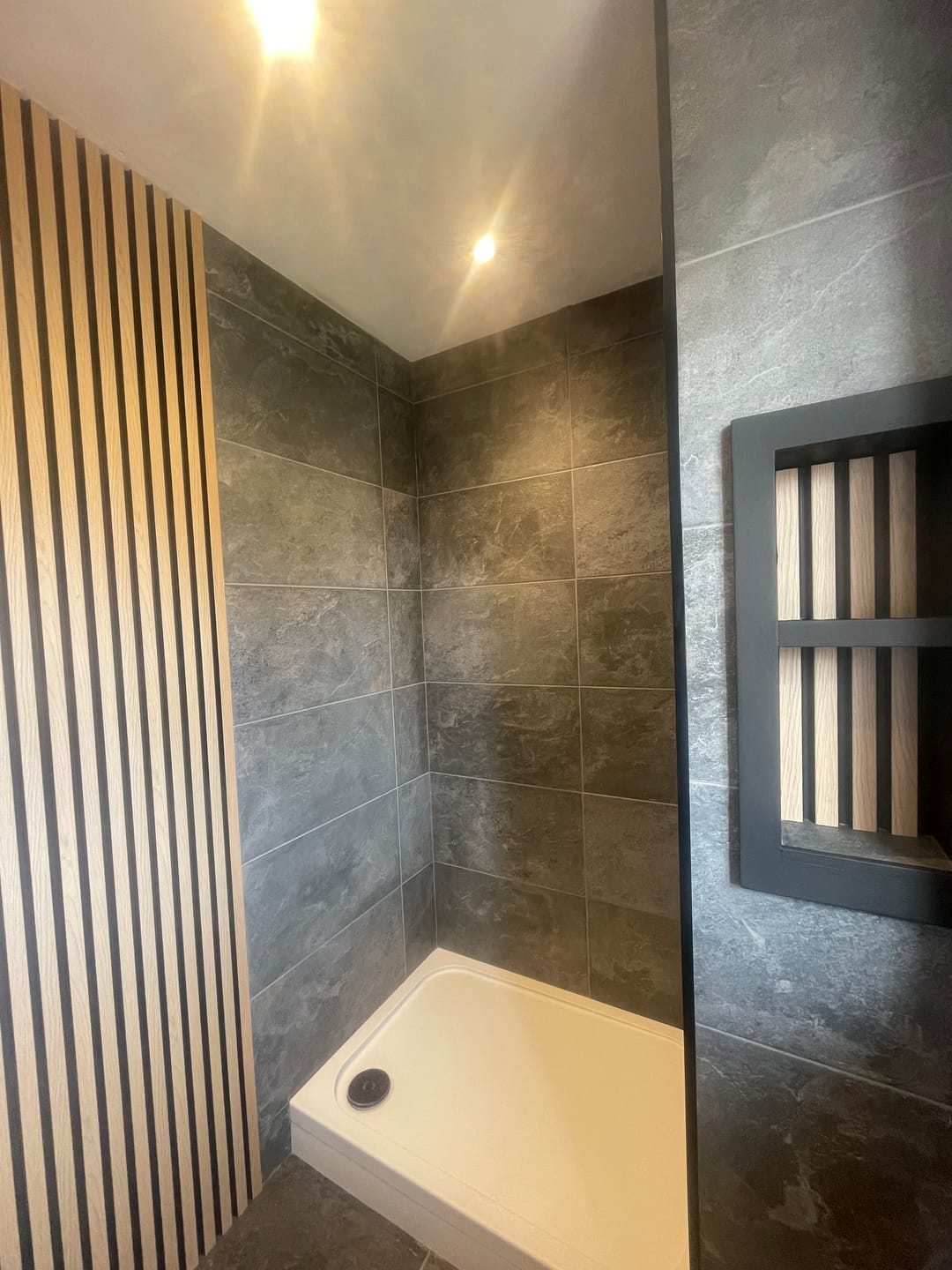 Customer photo review of SlatWall Waterproof Natural Oak and Black Wall Panel