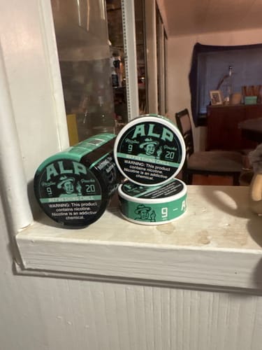 Customer's collection of ALP Refreshing Chill Nicotine Pouches sitting on a white windowsill.