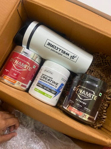 Reviewer's Wellcore stack in an open box, featuring the Creatine Monohydrate and a white steel shaker.