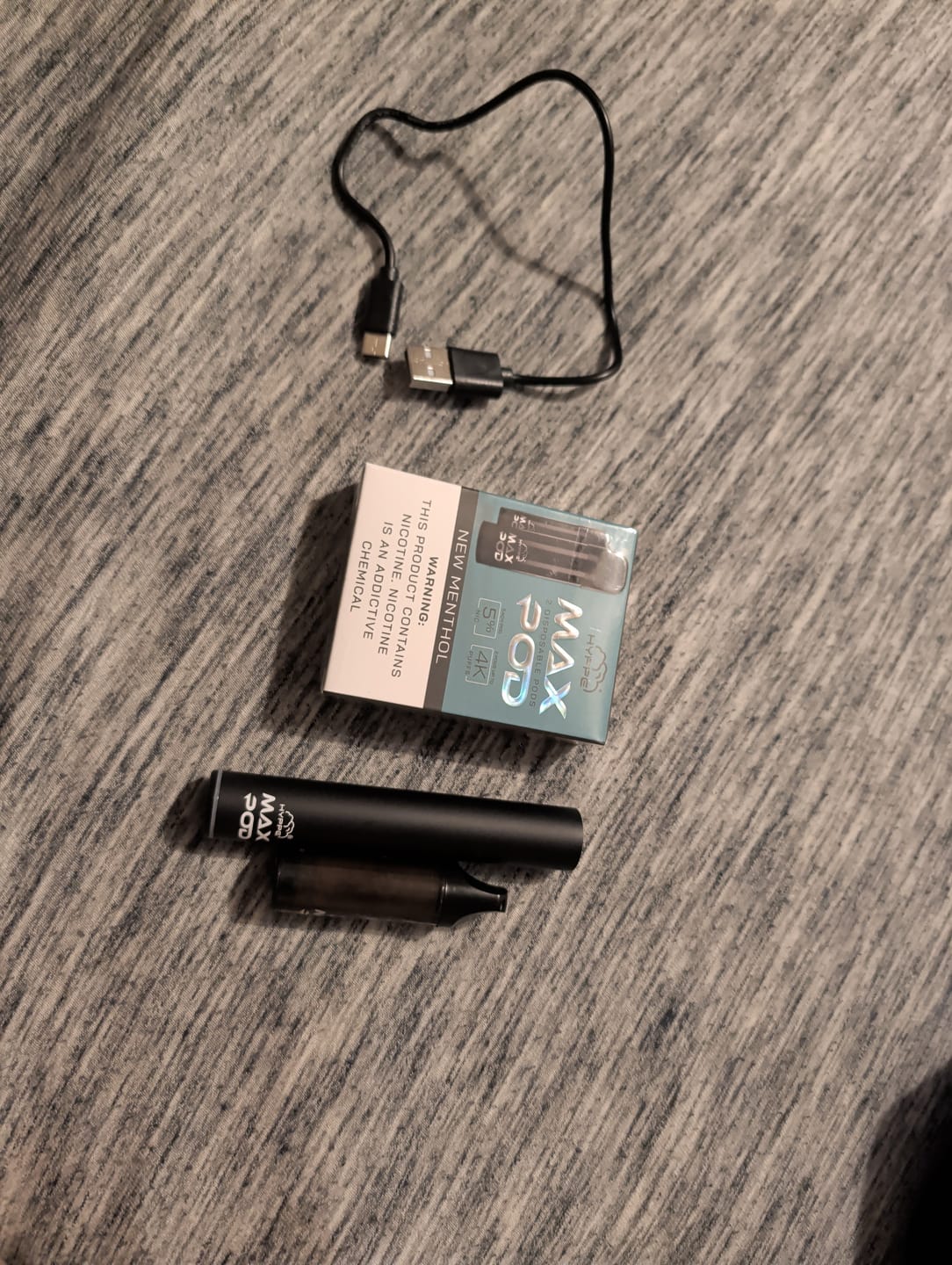 Customer's HYPPE Max Battery shown with the pod, charging cable, and pod packaging.