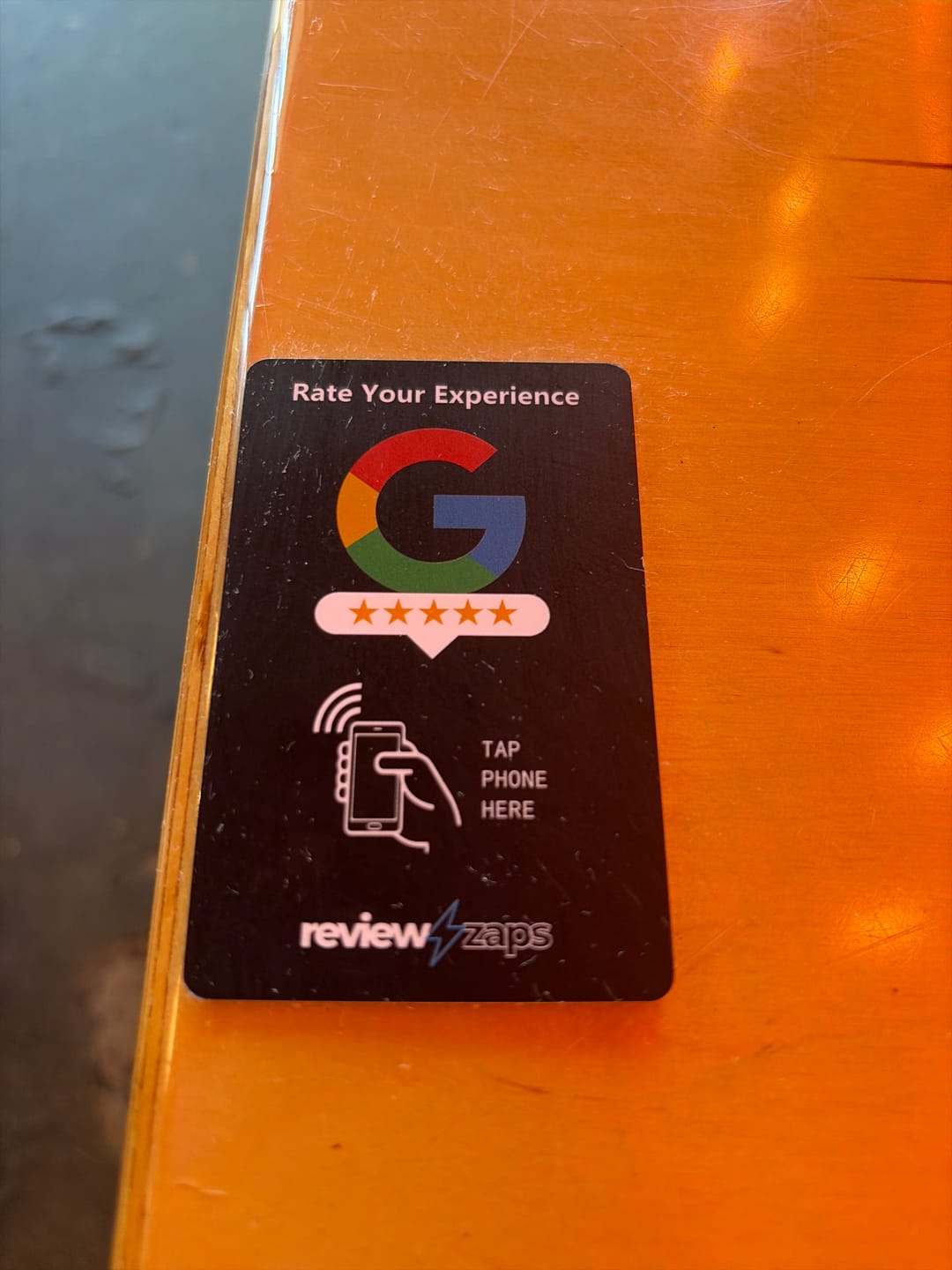 Customer photo review of NFC Google Review Card