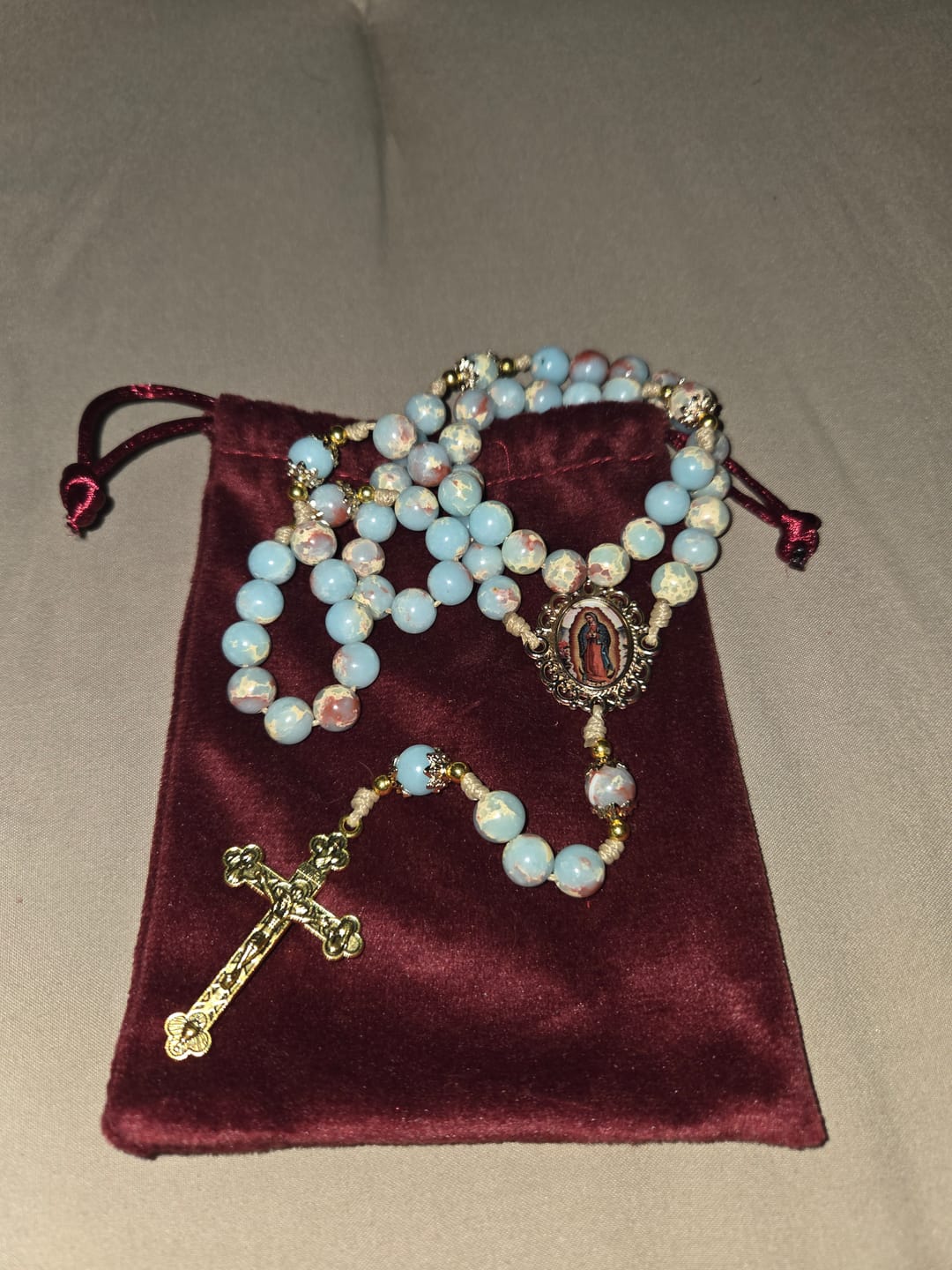 Customer photo review of Christianartworkshop Aqua Stone Prayer Rosary with Gold Accents: A Divine Source of Peace and Devotion