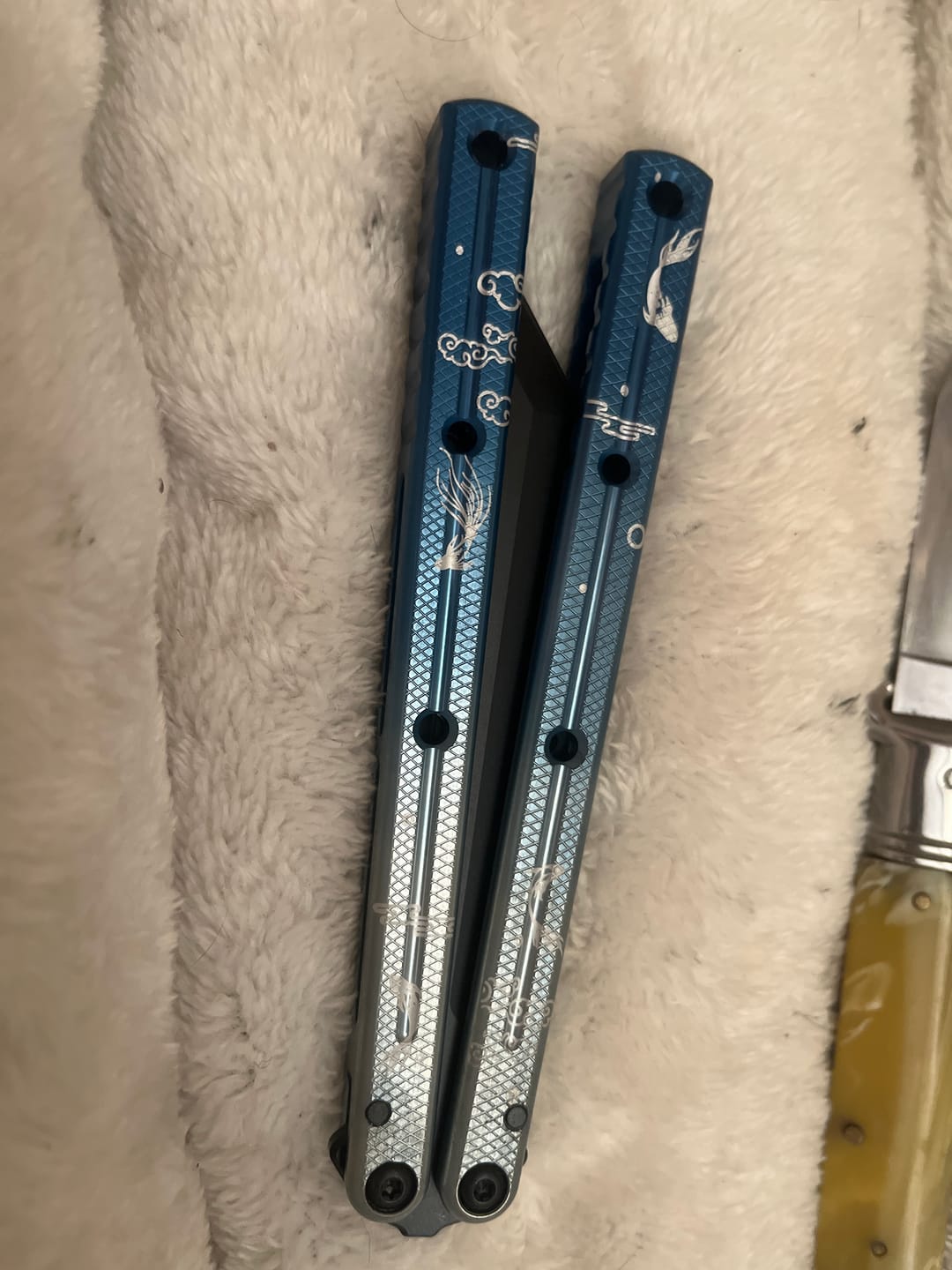 Customer photo review of Blue River Kraken Laser Pattern Bilateral Groove Glossy Laser Pattern 7075 Aluminum Handle Black Steel Screws Balisong Stainless Steel Blade  Clone Bushing