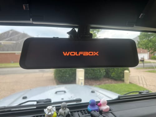 Customer's WOLFBOX G900PRO mirror camera with the anti-glare film installed, shown turned off inside a Jeep.