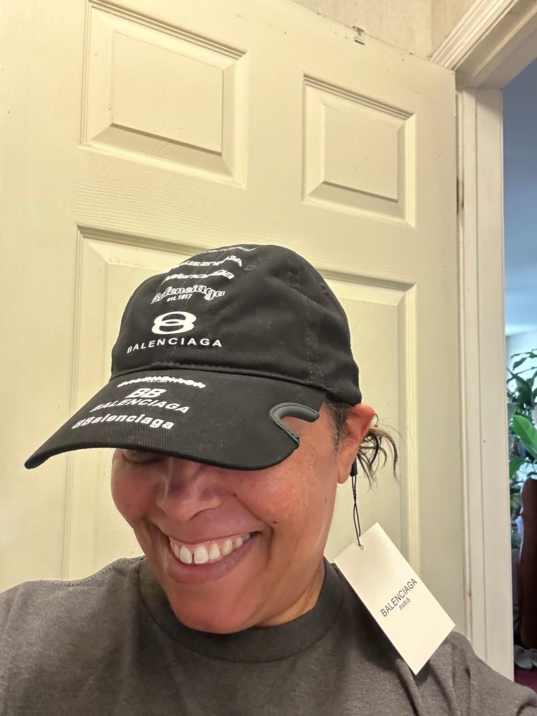 Customer photo review of Black cotton multi‑logo embroidery cap with sculpted brim