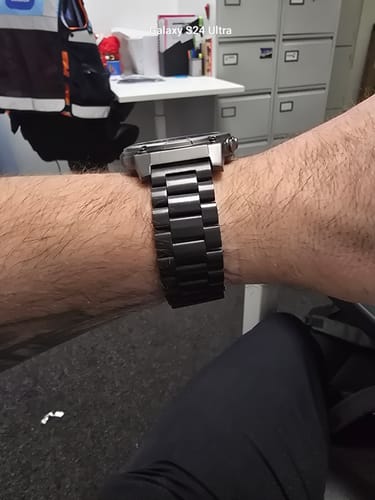 Customer's wrist showing the side view of the Black Steel Loop watch band attached to a smartwatch.