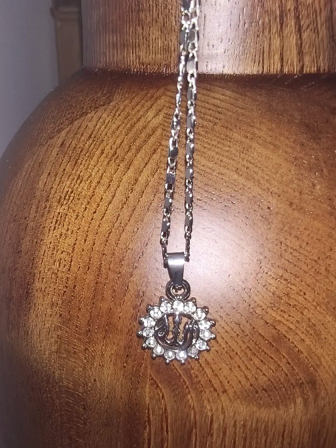 Customer photo review of HilalHaven Allah Sacred Arabic Calligraphy Sunburst Pendant Necklace