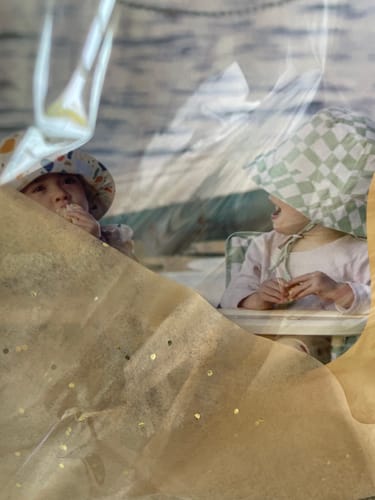 Partial view: A reviewer's abstract photo of a toddler in the Harper portable booster chair.