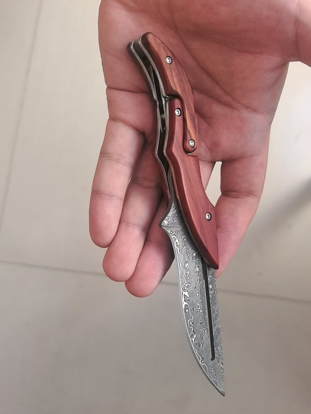 Customer photo review of Mechanical Damascus Folding Knife